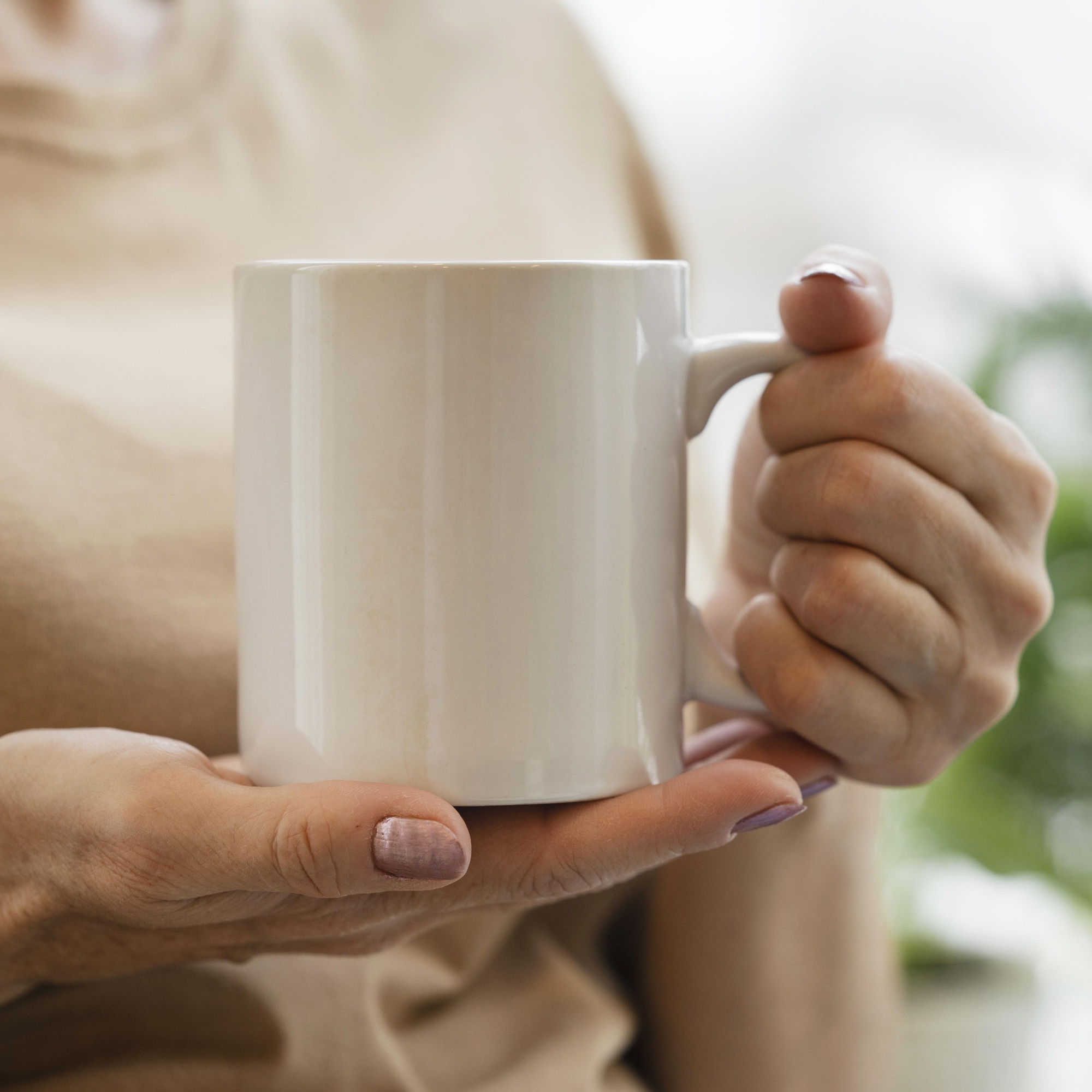 front-view-woman-enjoying-drink-mug-indoors